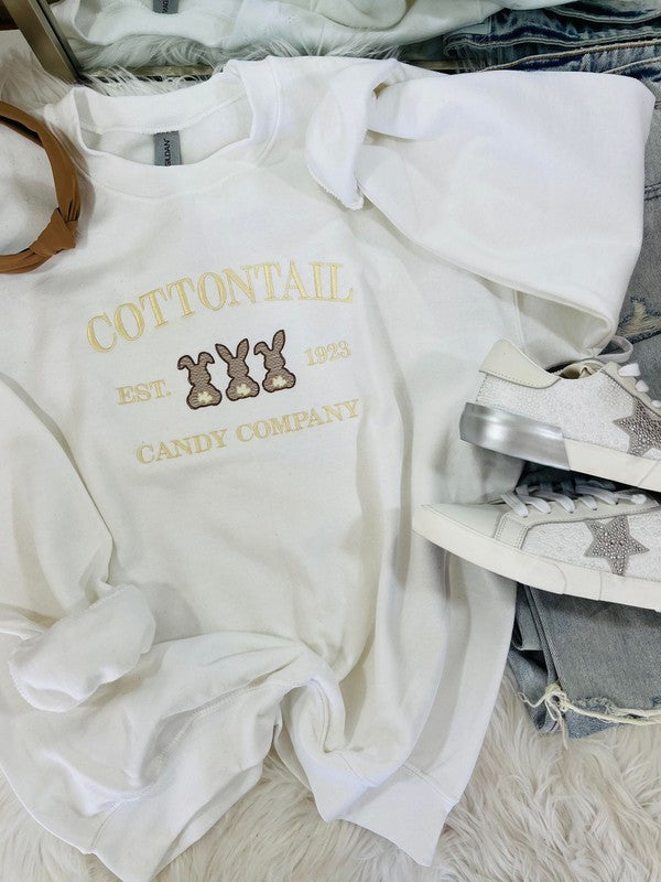 White sweatshirt with 'Cottontail Candy Co. est.