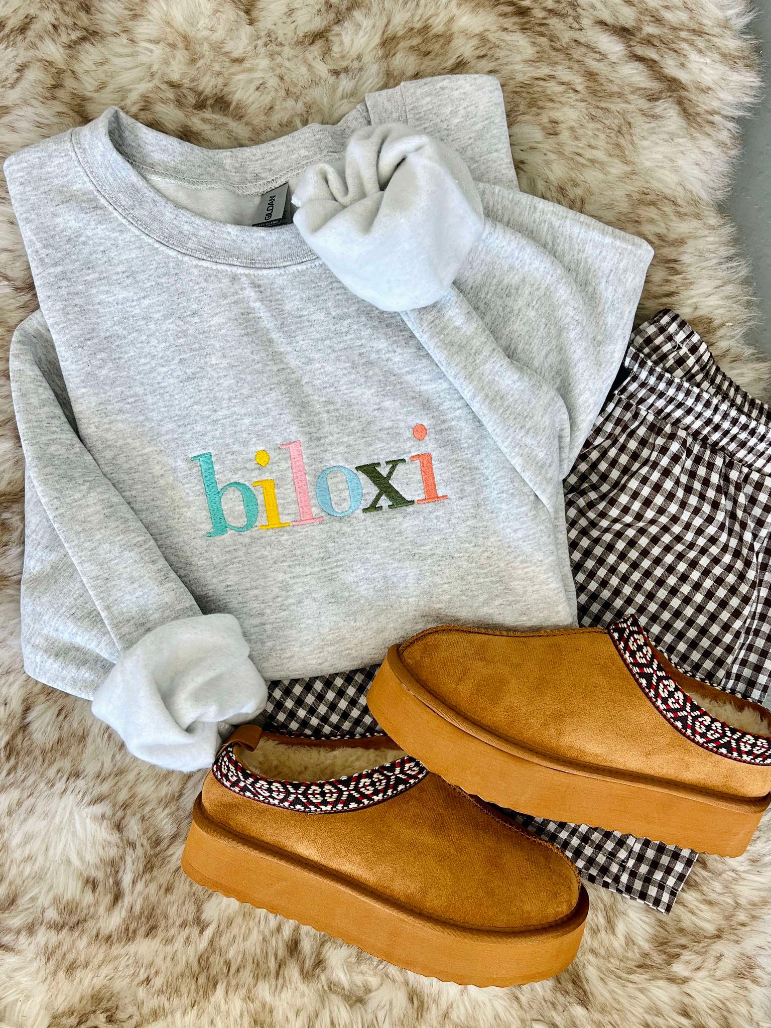 Ash sweatshirt with "Biloxi" on it in Muti color rainbow thread
