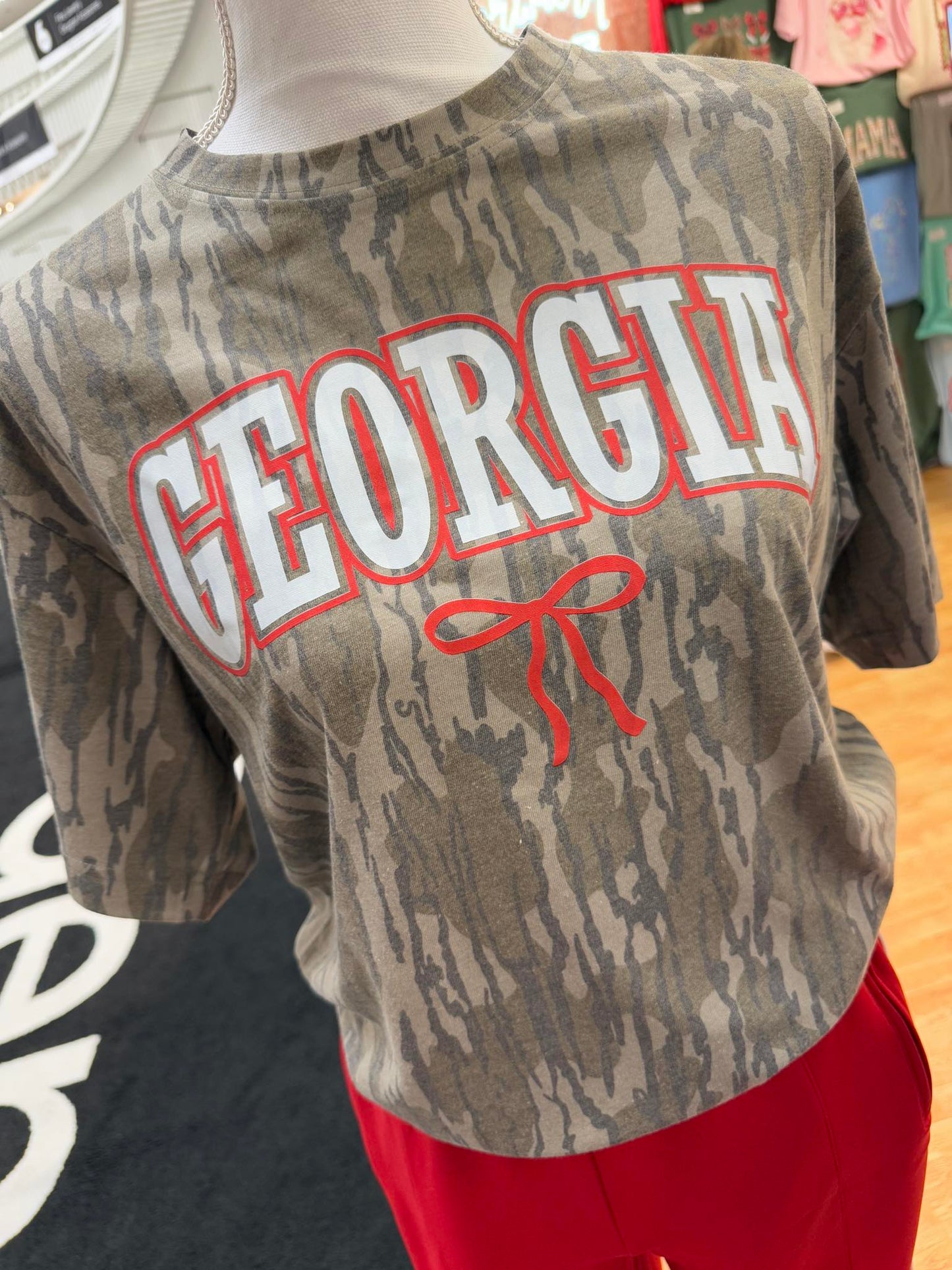 Mossy Oak Bottomland Camouflage shirt with 'Georgia' text on a mannequin